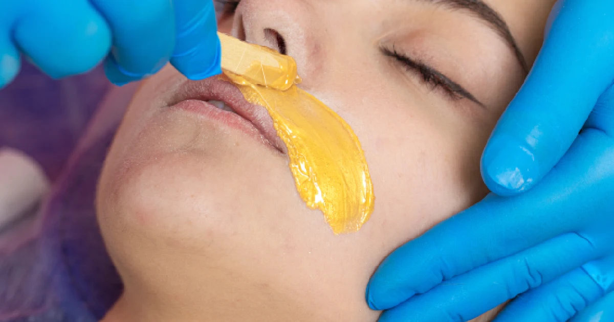 A woman receiving a professional lip waxing treatment in Tupelo, MS