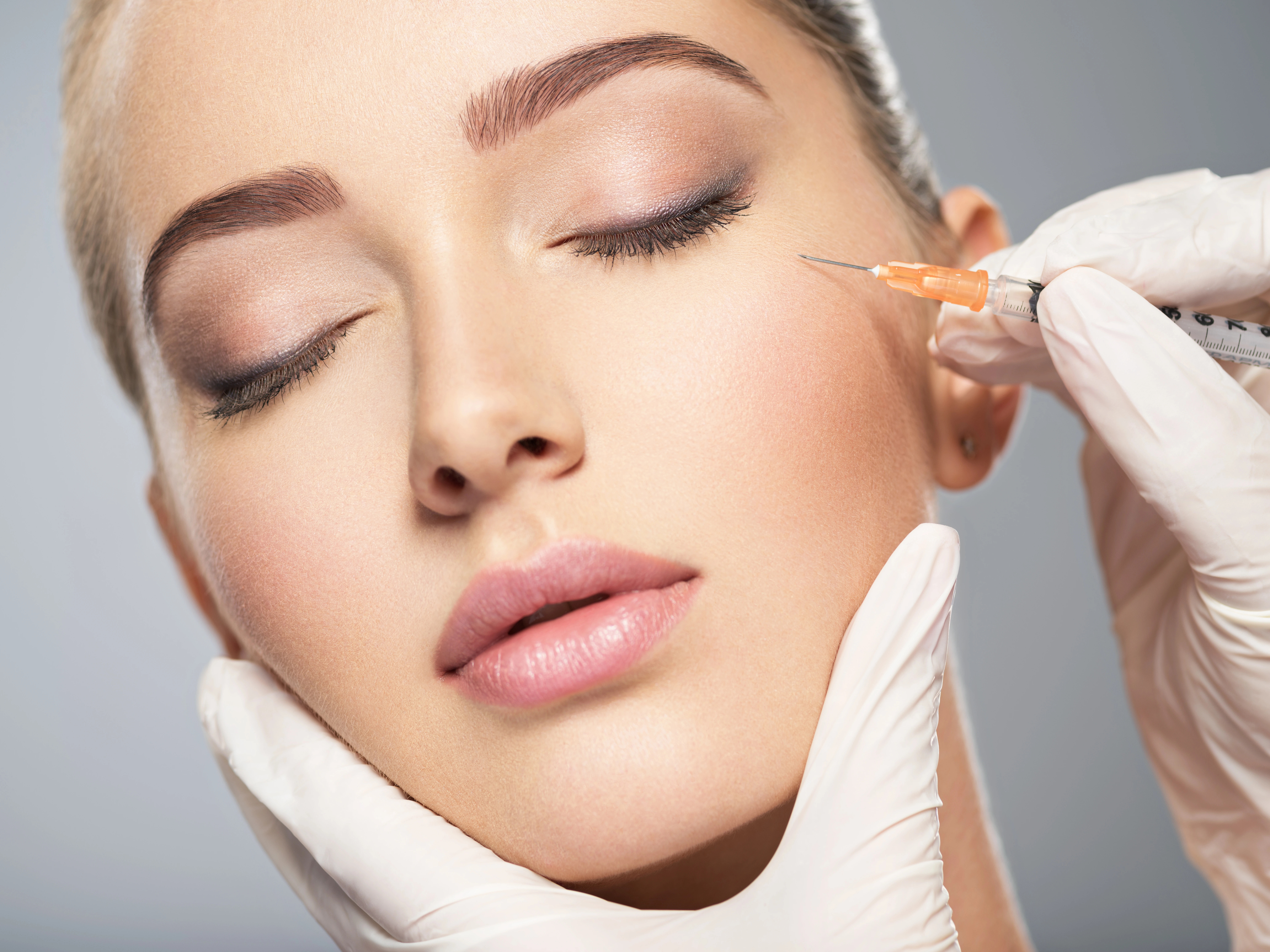 Woman receiving a Dysport injection for wrinkle reduction at Remedy Tupelo.