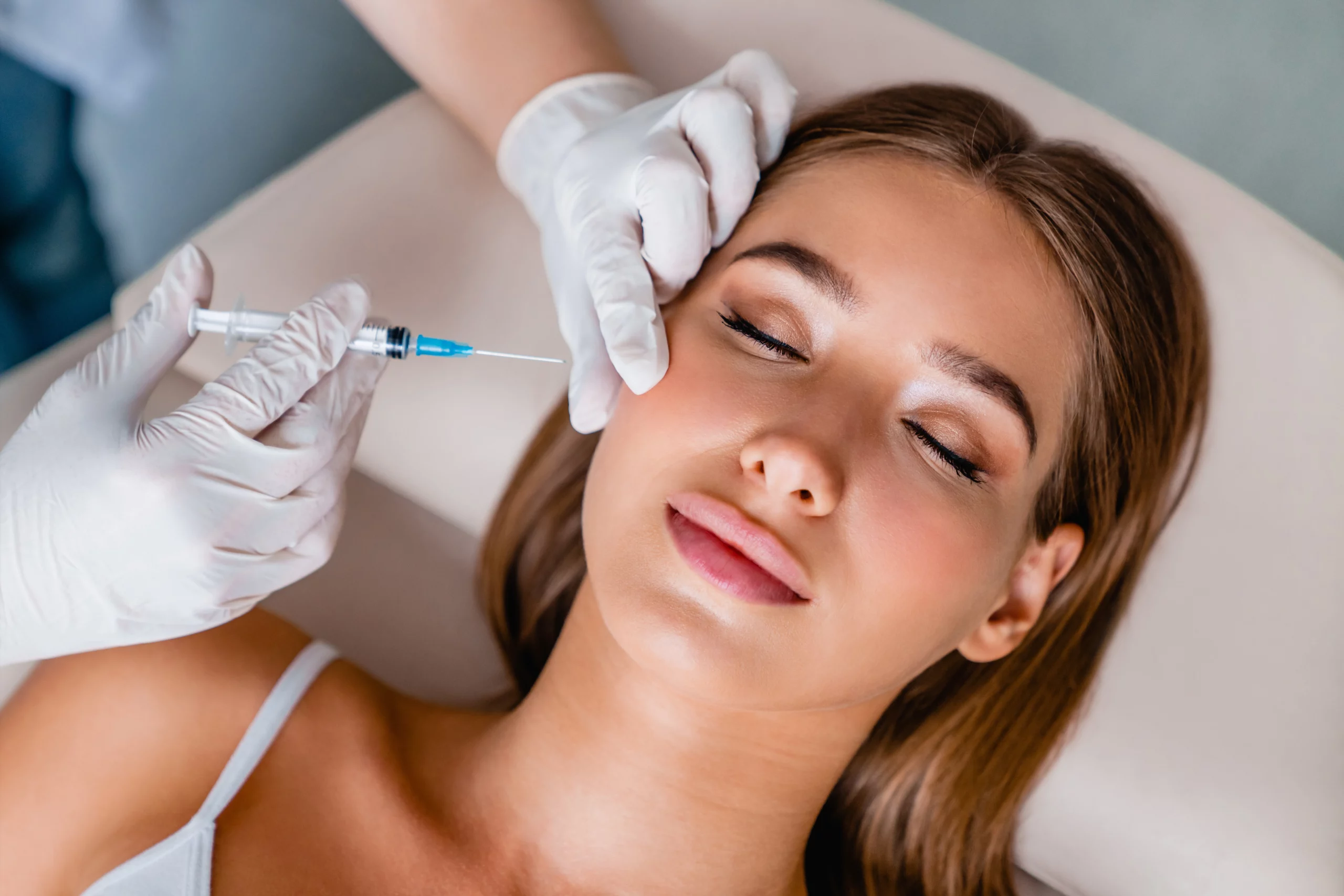 A woman receiving Botox treatment at Remedy Tupelo to reduce fine lines and wrinkles.